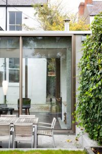 Beautiful Glazed House Feels Like a Garden's Extension